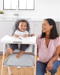 child sitting in a high chair